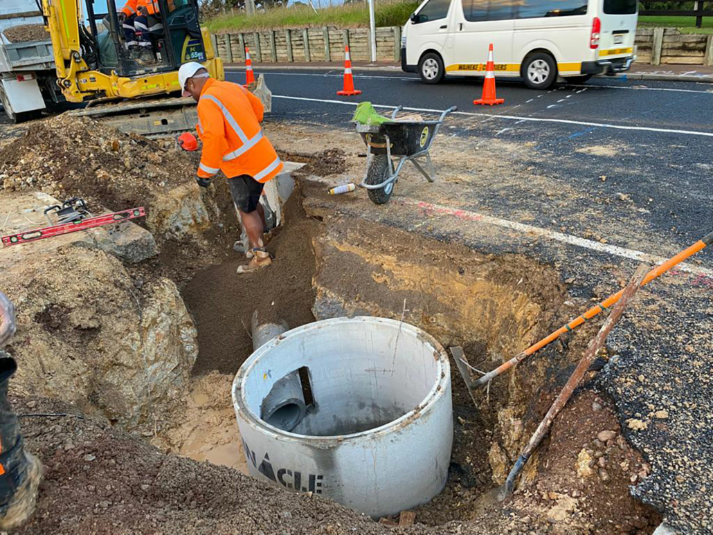 a drain being installed under a road